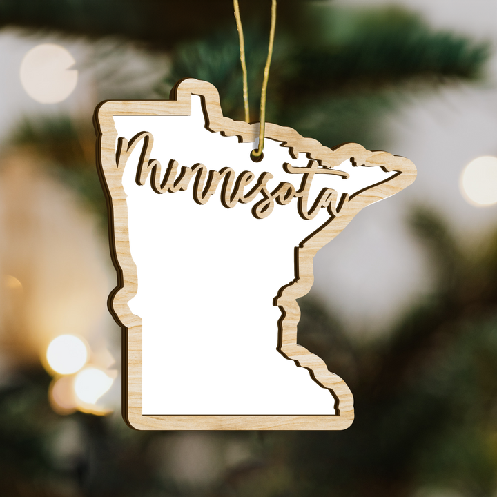 Minnesota state-shape wood ornament on a tree, blank photo panel for your own picture