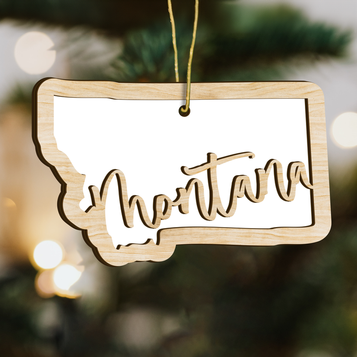 Montana state-shape wood ornament on a tree, blank photo panel for your own picture
