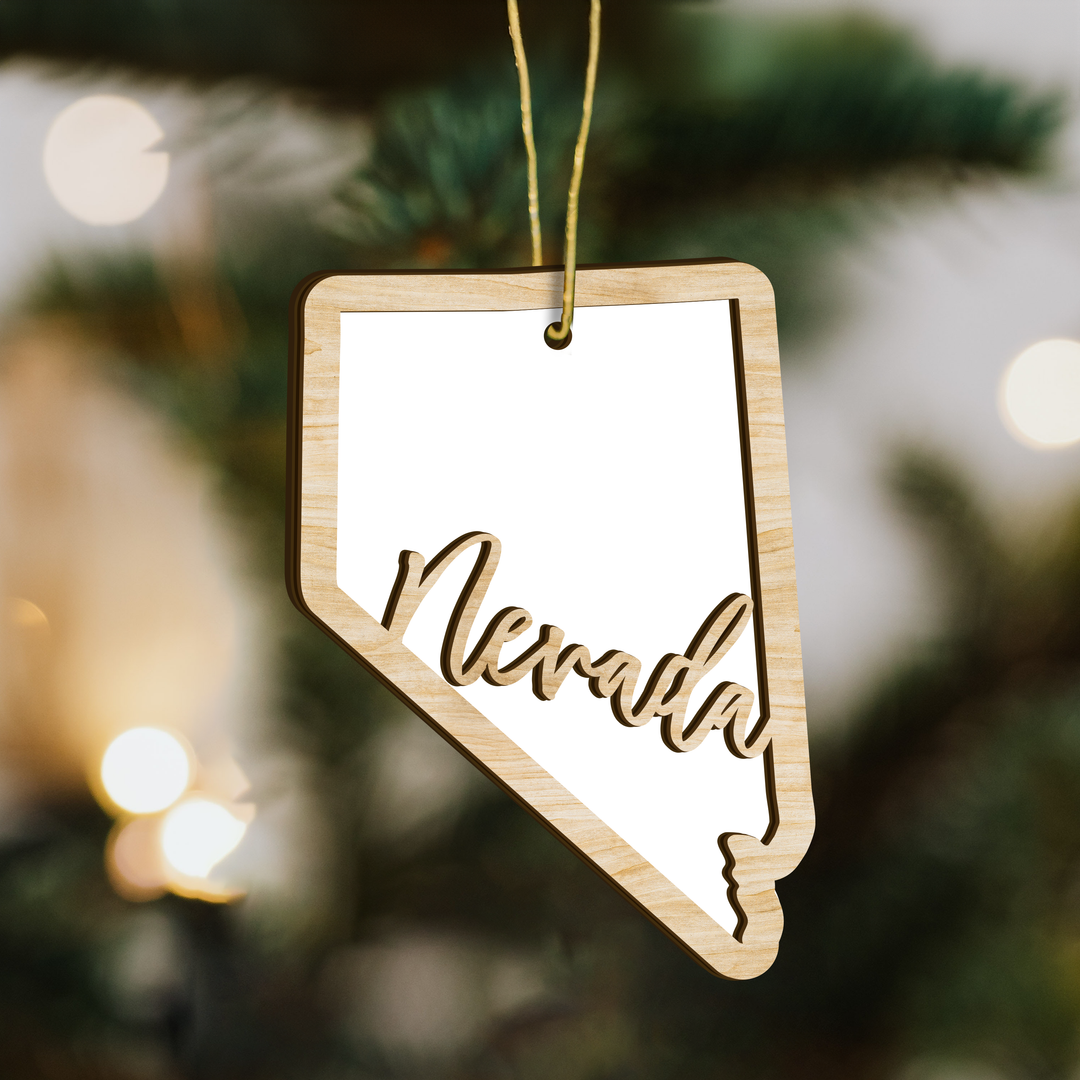 Nevada state-shape wood ornament on a tree, blank photo panel for your own picture