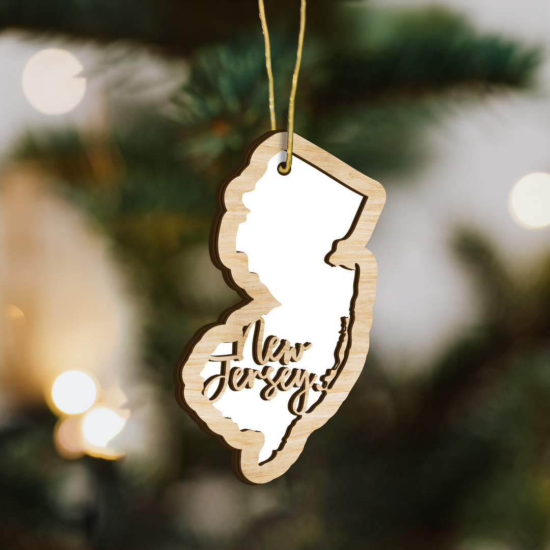 New Jersey state-shape wood ornament on a tree, blank photo panel for your own picture