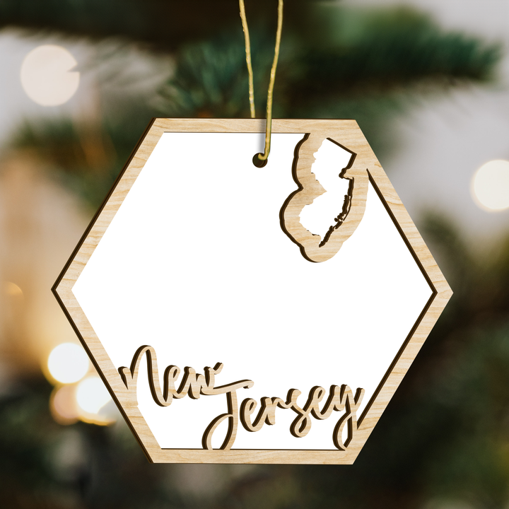New Jersey hexagon wood ornament on a tree, blank photo panel with the state outline