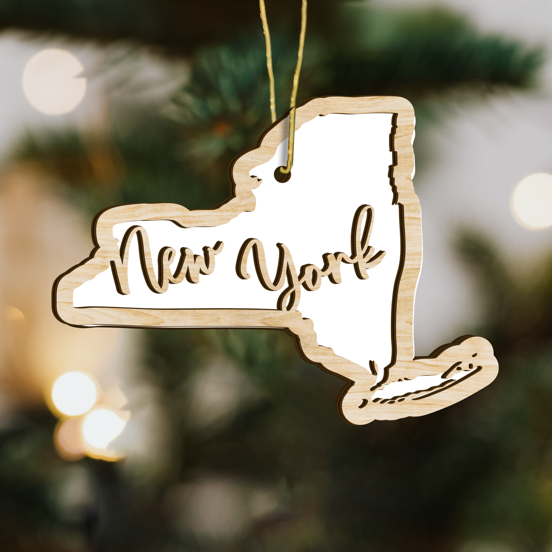 New York state-shape wood ornament on a tree, blank photo panel for your own picture