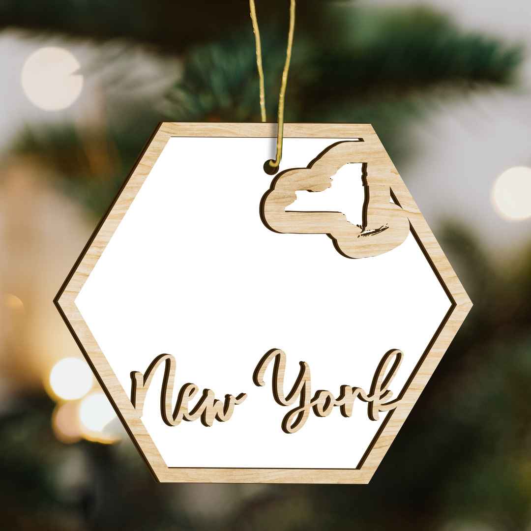 New York hexagon wood ornament on a tree, blank photo panel with the state outline