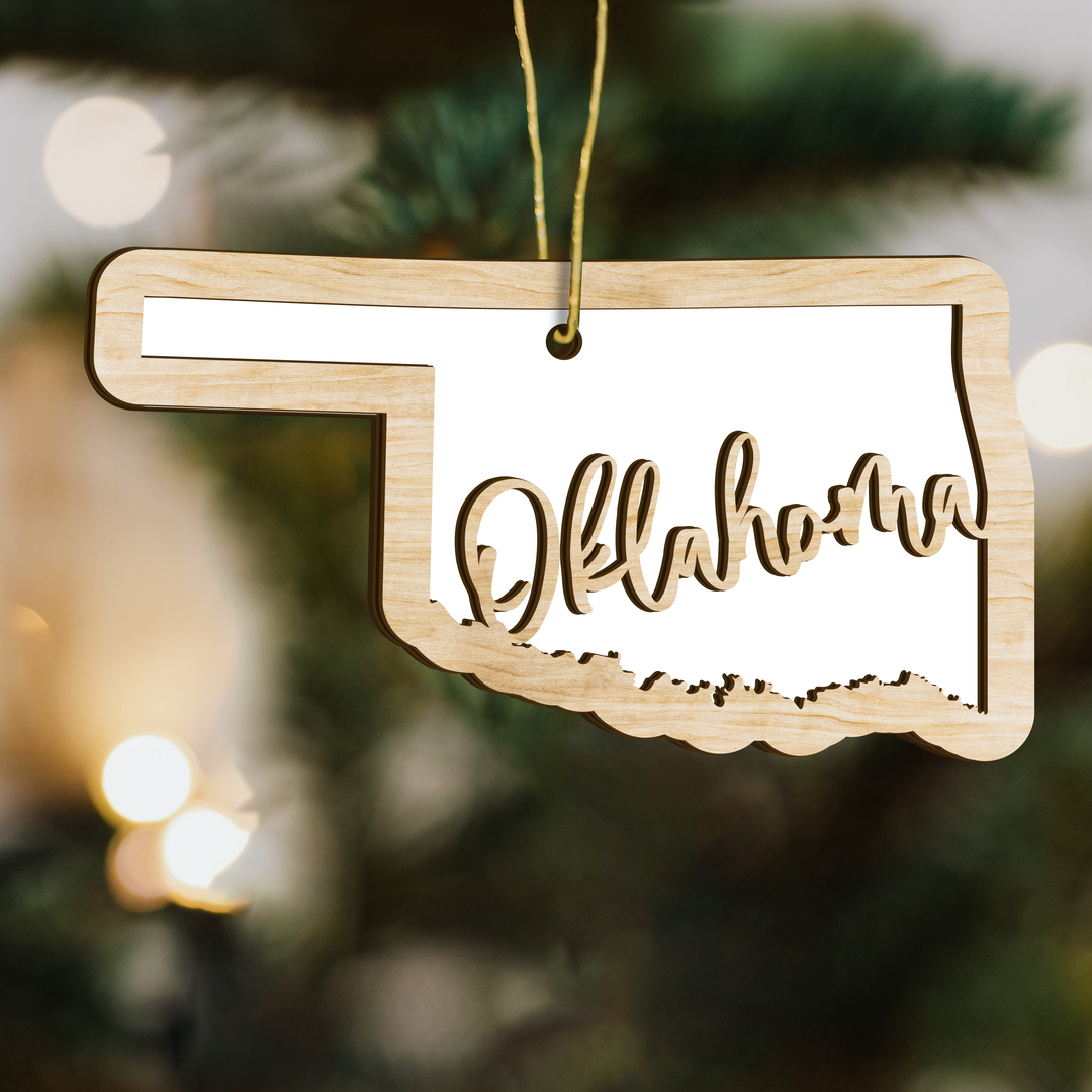 Oklahoma state-shape wood ornament on a tree, blank photo panel for your own picture