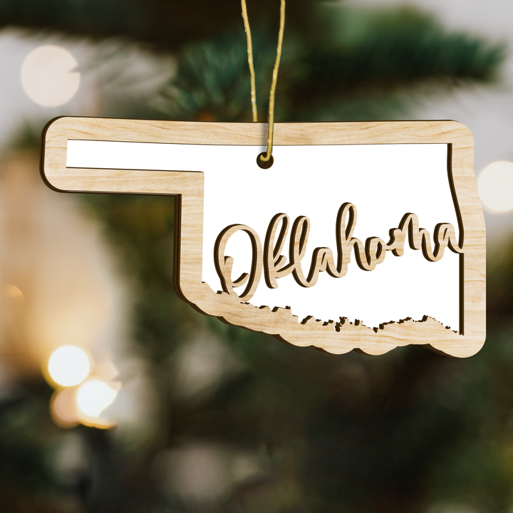 Oklahoma state-shape wood ornament on a tree, blank photo panel for your own picture