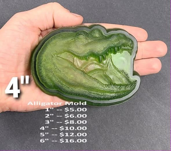 Alligator head mold with parted jaws and a textured snout, cast in green