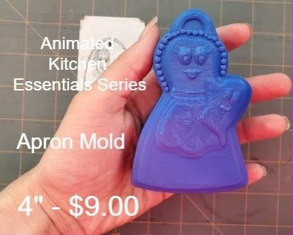Cartoon apron mold with a smiling face on the bib and ruffled trim, cast in blue