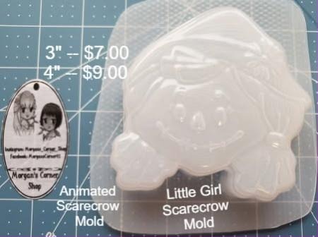 Clear plastic mold of a little girl scarecrow with braids and a floppy hat