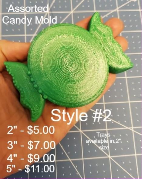 Assorted candy mold, a wrapped hard candy with a spiral swirl face and twisted wrapper ends