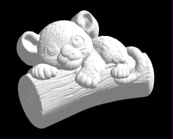 Baby jaguar mold, a spotted cub draped over a fallen log with its paws hanging over the front