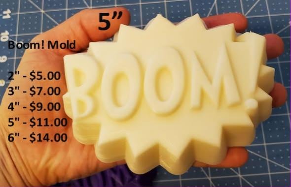 BOOM! comic burst mold cast in cream, the word inside a jagged starburst