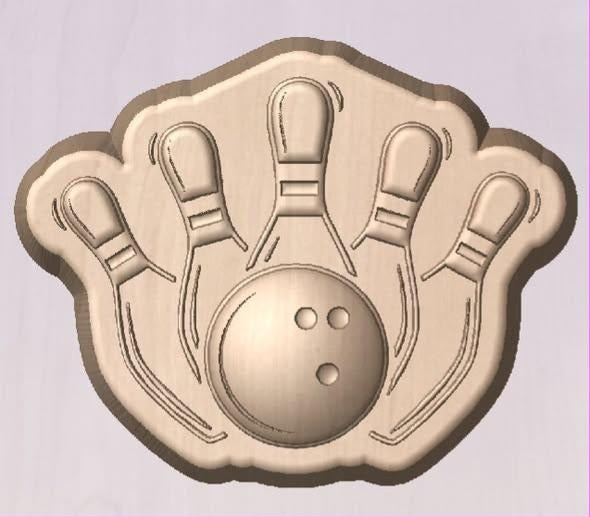 Bowling mold with a ball and five pins fanned out behind it on a shaped plaque