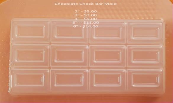Clear plastic mold that casts one chocolate bar scored into twelve break-apart squares