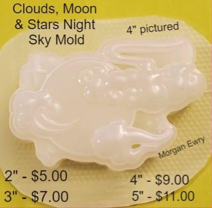 Plastic mold of a night sky scene with a crescent moon, clouds, stars and a shooting star