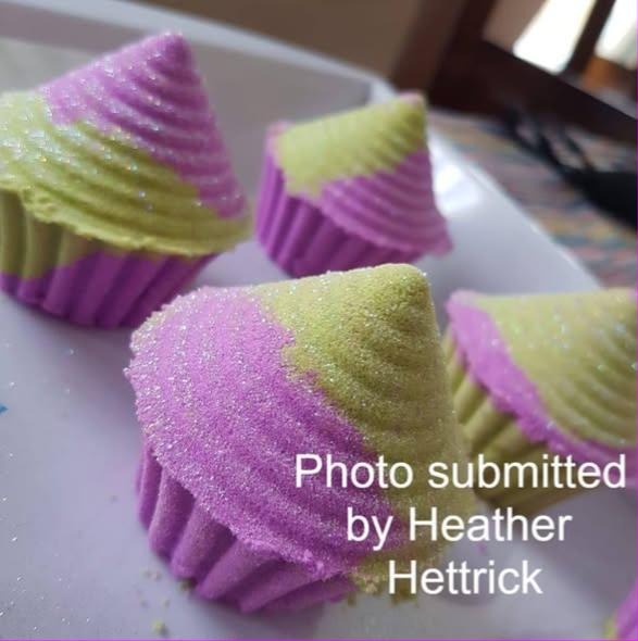 Cast cupcakes in purple fluted cases with sugared tops, made from the cupcake mold