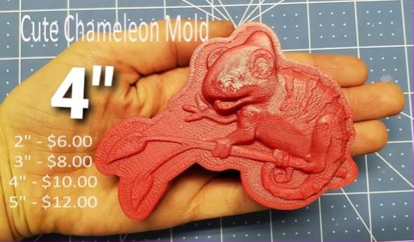 Coral cast of a chameleon with a coiled tail, ridged crest and pebbled skin