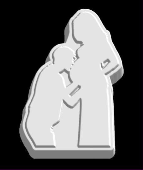 Mold of a pregnant woman in silhouette with her partner kissing her bump