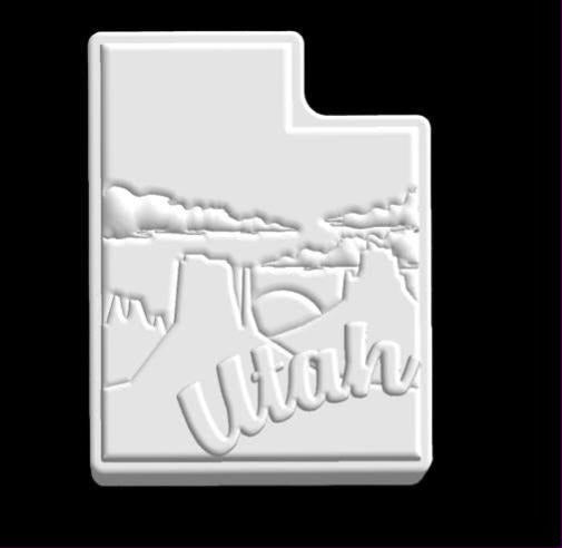 Mold of the Utah state outline with canyon mesas, clouds and script lettering