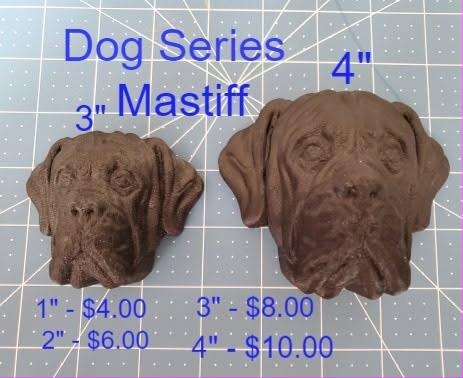Two brown casts of a mastiff head showing a wrinkled brow and heavy jowls