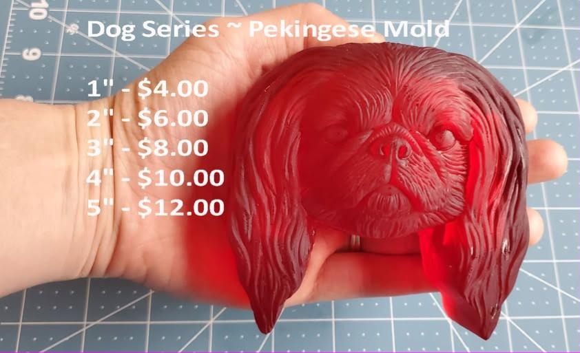 Red cast of a pekingese dog head with a flat face and a thick mane of hair