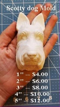 Cream and tan cast of a Scottish terrier head with upright ears and a long beard