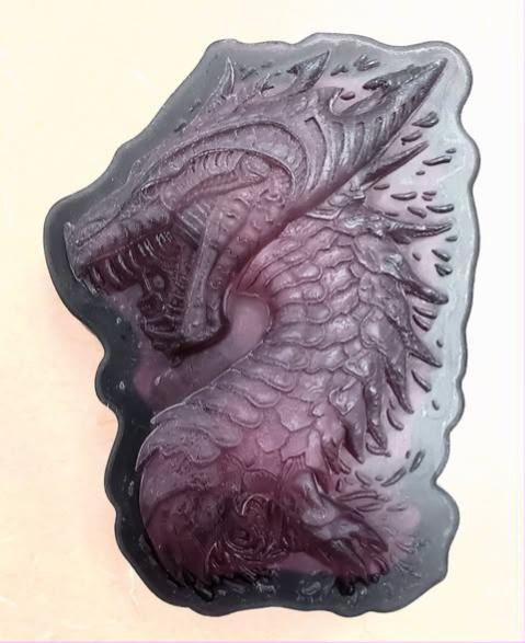 Purple and grey cast of a detailed dragon head with scales, horns and a spined frill