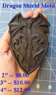 Bronze cast of a heraldic shield with a winged dragon across the face