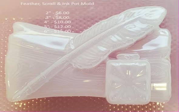 Clear plastic mold sheet with three cavities: a feather quill, a rolled scroll and a square ink pot.