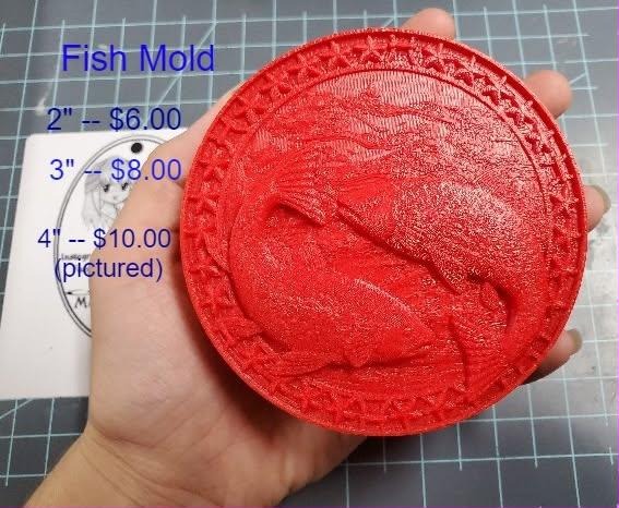 Round fish medallion mold printed in red, leaping fish inside a braided star-set border