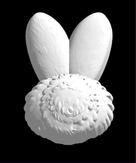 Cast mold of two upright bunny ears above a round fluffy pom-pom rabbit tail