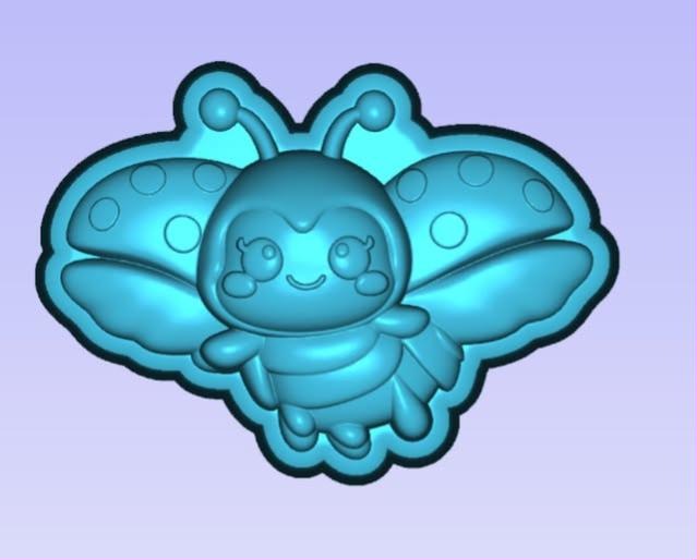 Cute cartoon ladybug mold with a smiling face, curled antennae and spotted wings spread wide.