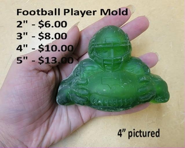 Football player mold, helmeted player crouched in a stance with heavy squared shoulder pads.