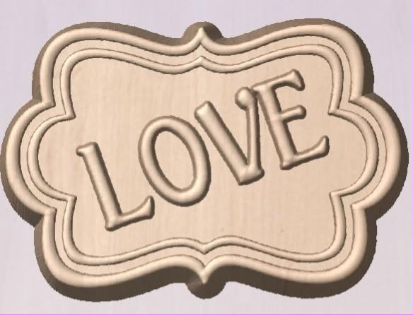 Framed LOVE mold cast in tan, raised capital letters inside an ornate scalloped bracket frame