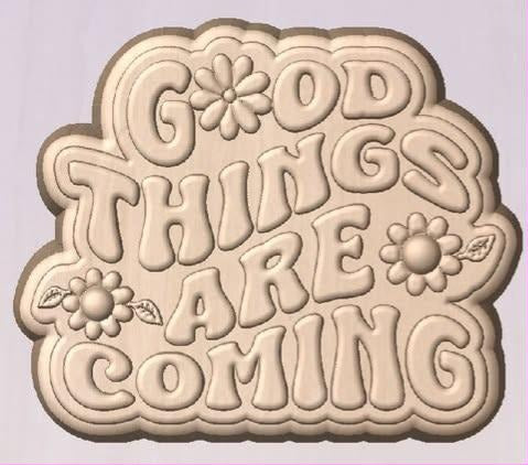 Word plaque mold with GOOD THINGS ARE COMING in fat bubble capitals and daisies tucked into the gaps.