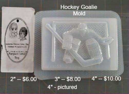 Cast bar mold showing a masked hockey goalie with pads and stick on a textured panel