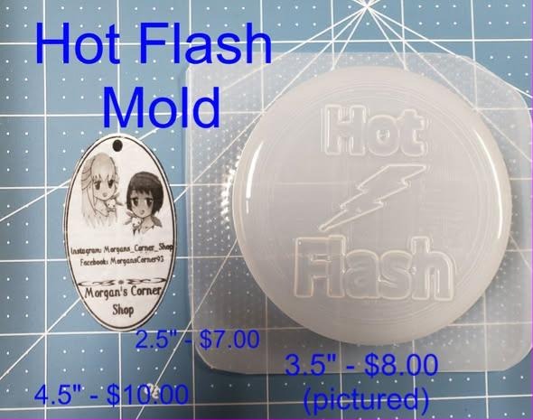 Clear plastic round Hot Flash mold with outlined lettering and a lightning bolt between