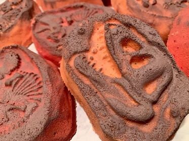Grey and brown dino fossil soaps stacked together