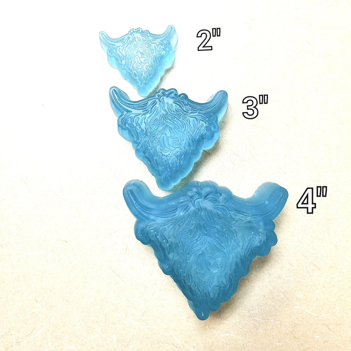 Three blue highland cow casts stepped down in size, labelled two, three and four inches.