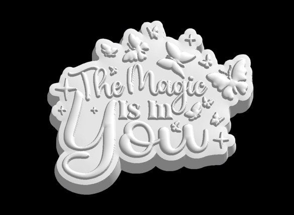 Grey render of The Magic Is In You mold, looping script with a long swash under You.