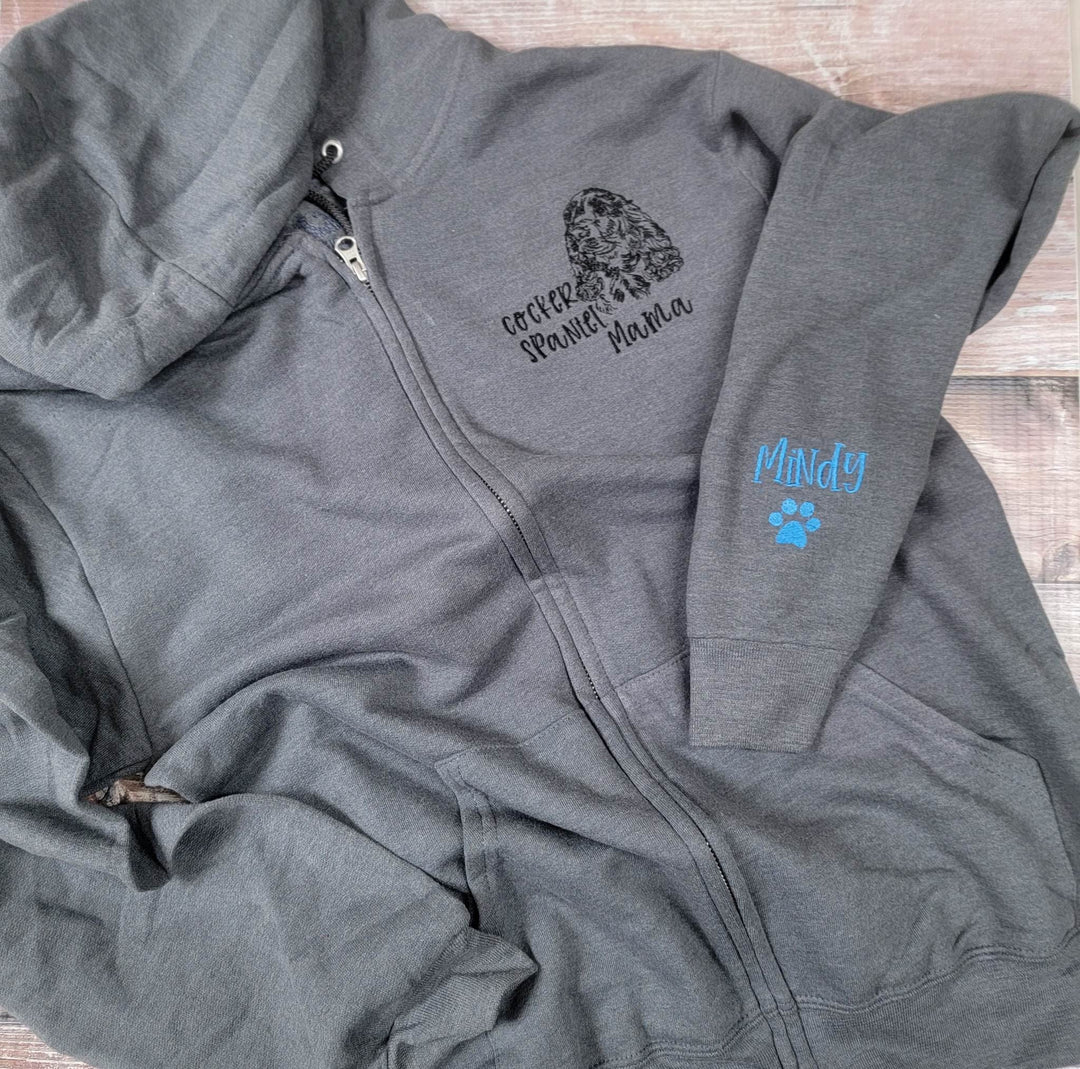 Grey zip-front embroidered with a cocker spaniel head, Cocker Spaniel Mama and Mindy on the sleeve.