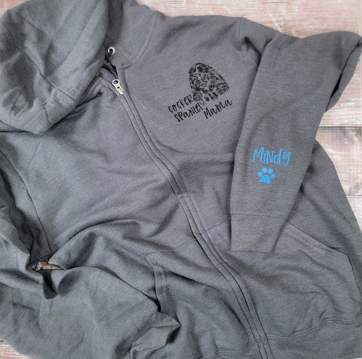Grey zip-front embroidered with a cocker spaniel head, Cocker Spaniel Mama and Mindy on the sleeve.