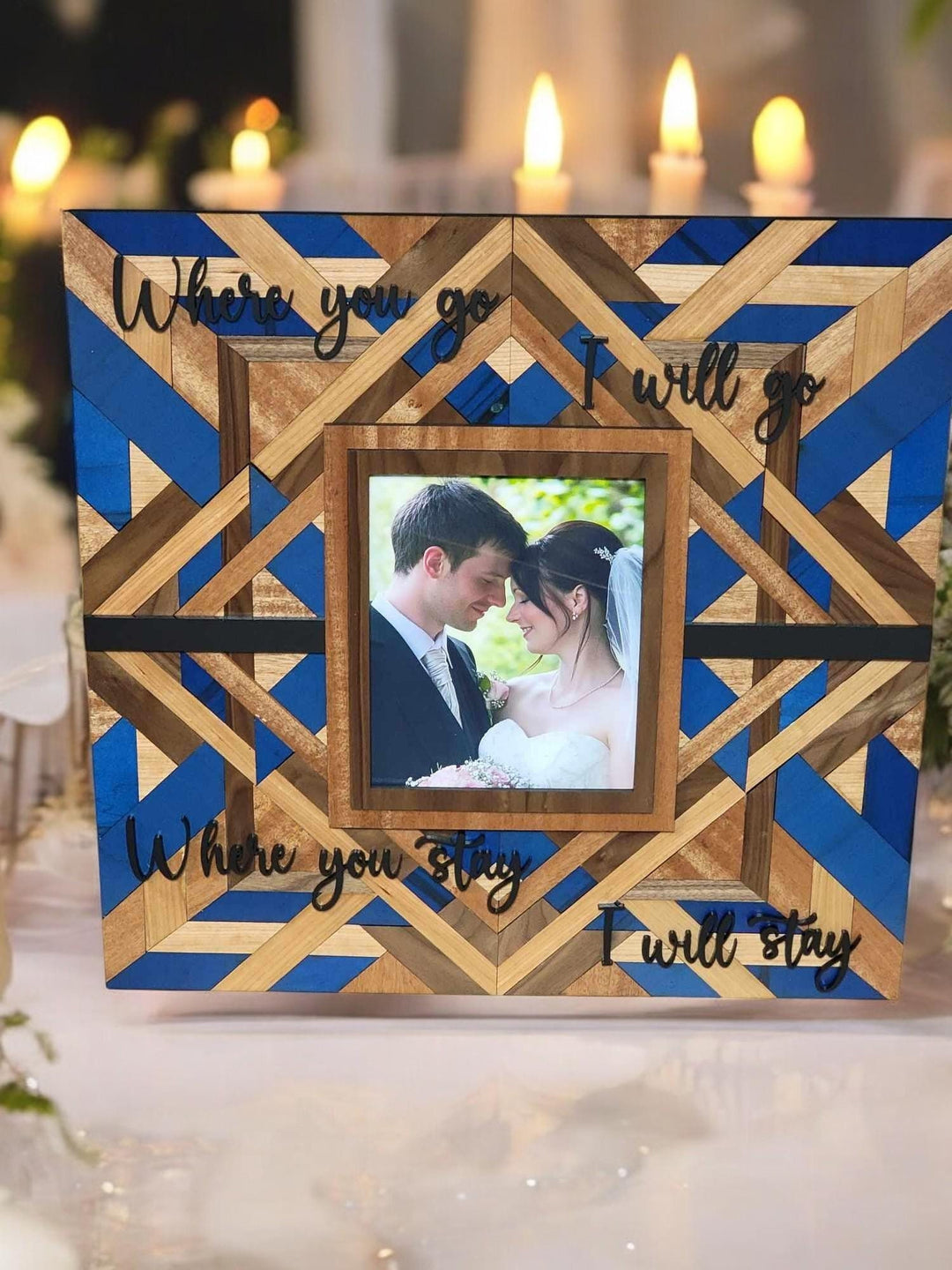 Navy and natural wood barn quilt panel with a wedding photo at the centre and raised lettering.