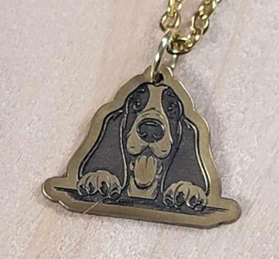 Engraved brass dog pendant necklace shown worn