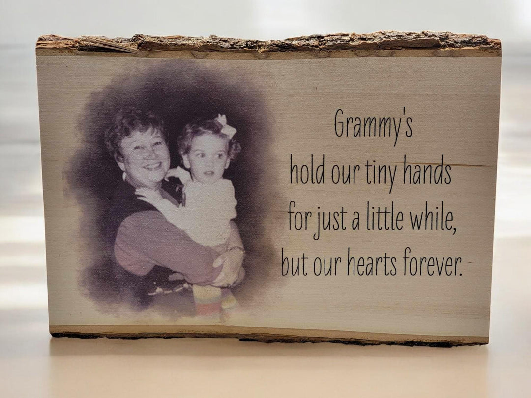Live-edge wood slab with bark on the top edge, a sepia photo printed into the grain beside a verse.