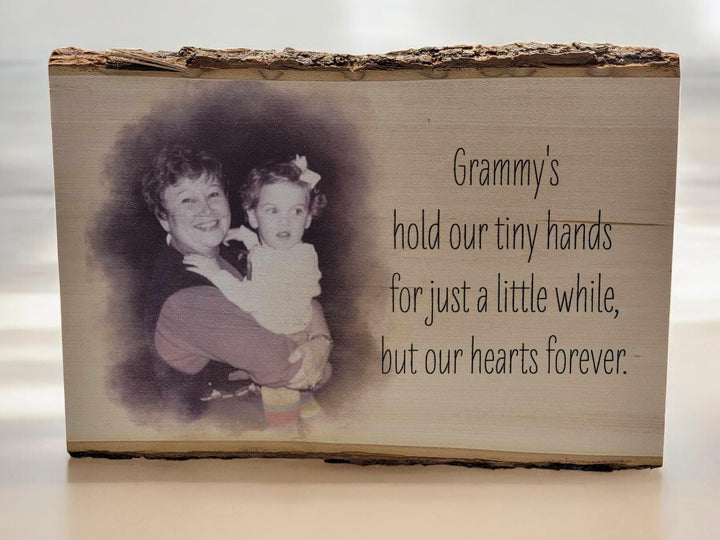 Live-edge wood slab with bark on the top edge, a sepia photo printed into the grain beside a verse.