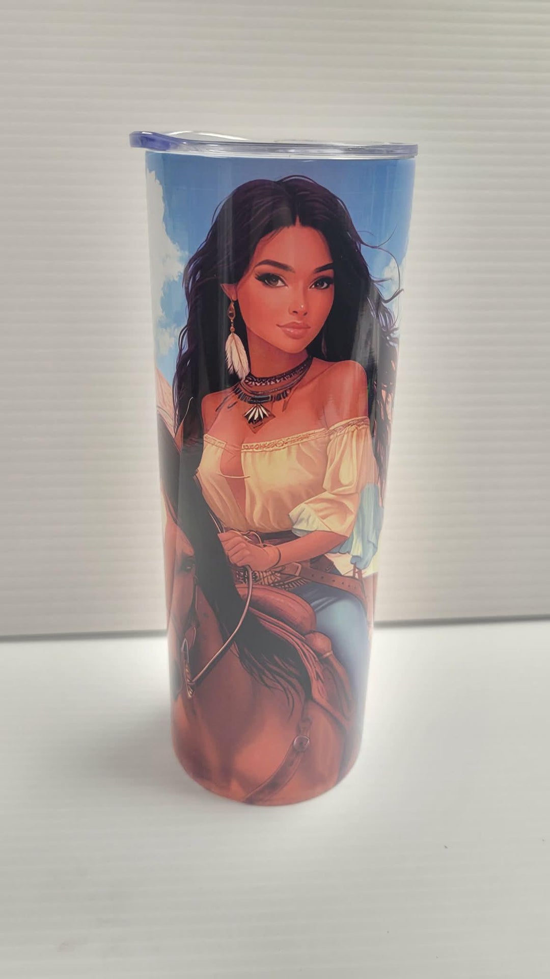 Cowgirl tumbler shown with the clear sliding lid in place