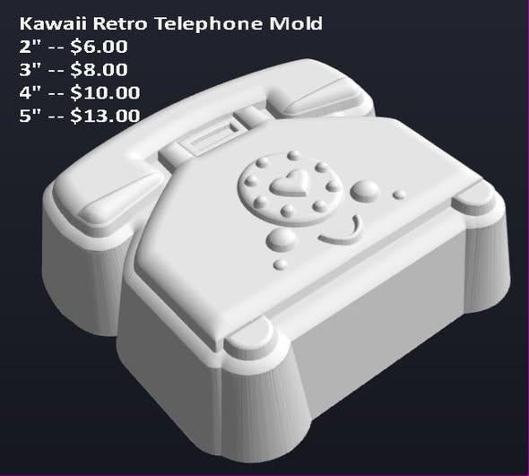 Kawaii rotary telephone mold, handset on its cradle above a finger-hole dial with a face