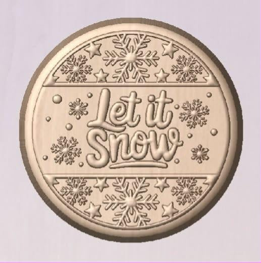 Round coin mold with Let it Snow in script across the middle and bands of snowflakes and stars above and below.