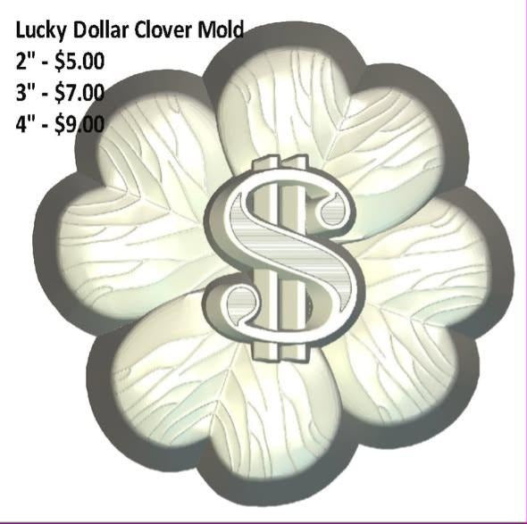 Four-leaf clover mold cast in cream with veined leaves and a dollar sign ring at the centre