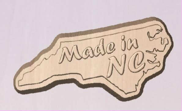 North Carolina state outline mold with Made in NC engraved across it in flowing script.